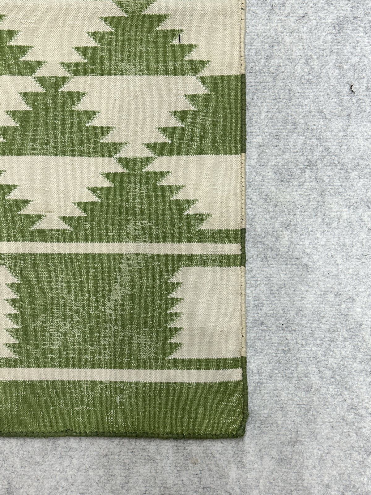 Verdant Kilim Cotton Rug-Green cotton rug styled in a living room interior
