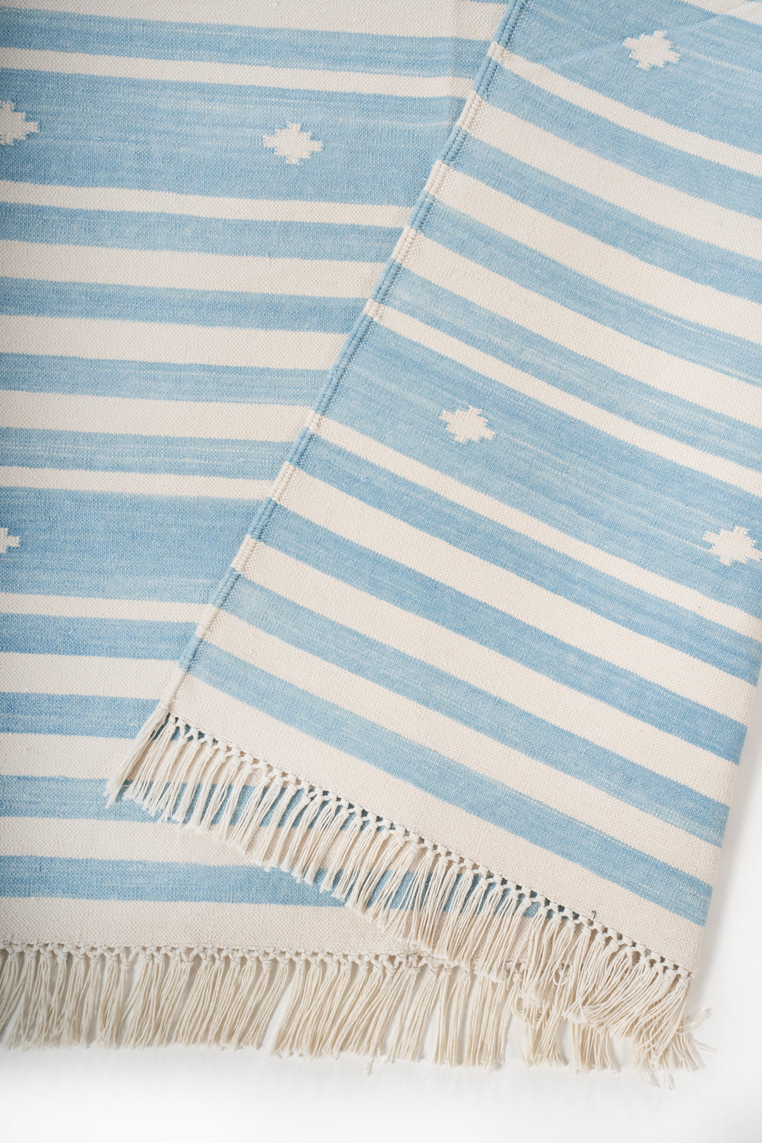 Whisper Flatweave Rug detail showing the textured cotton surface and finishing