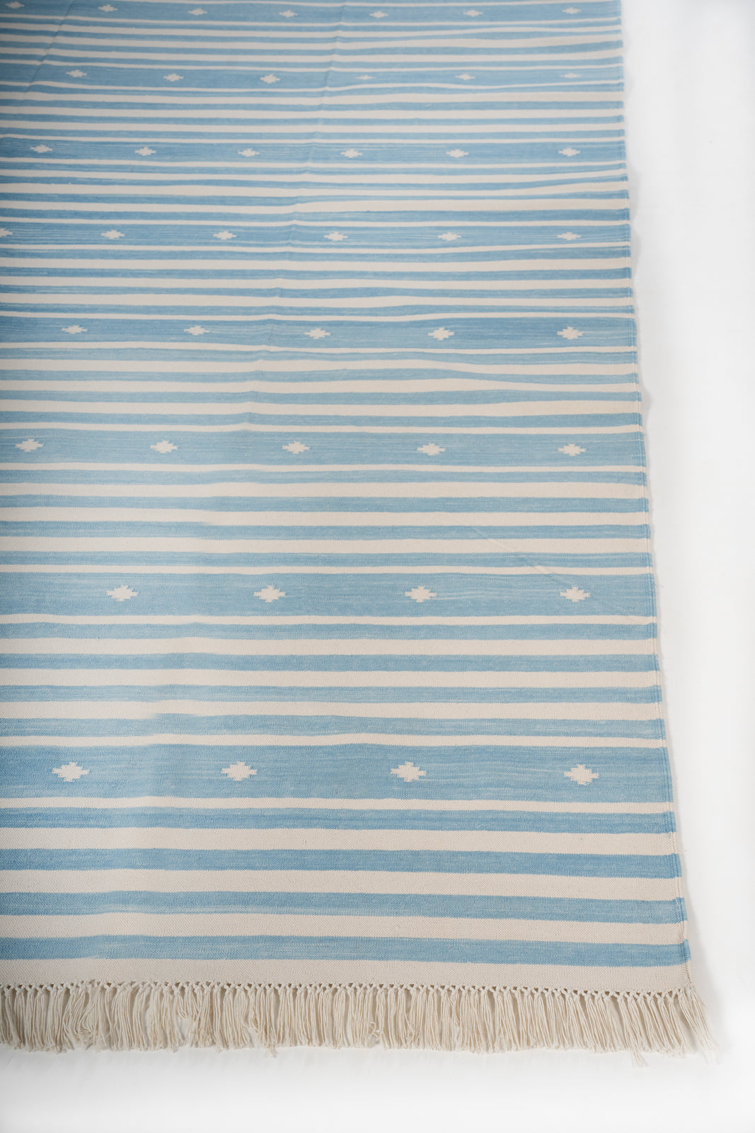 Whisper Flatweave Rug cotton rug styled in a living room interior