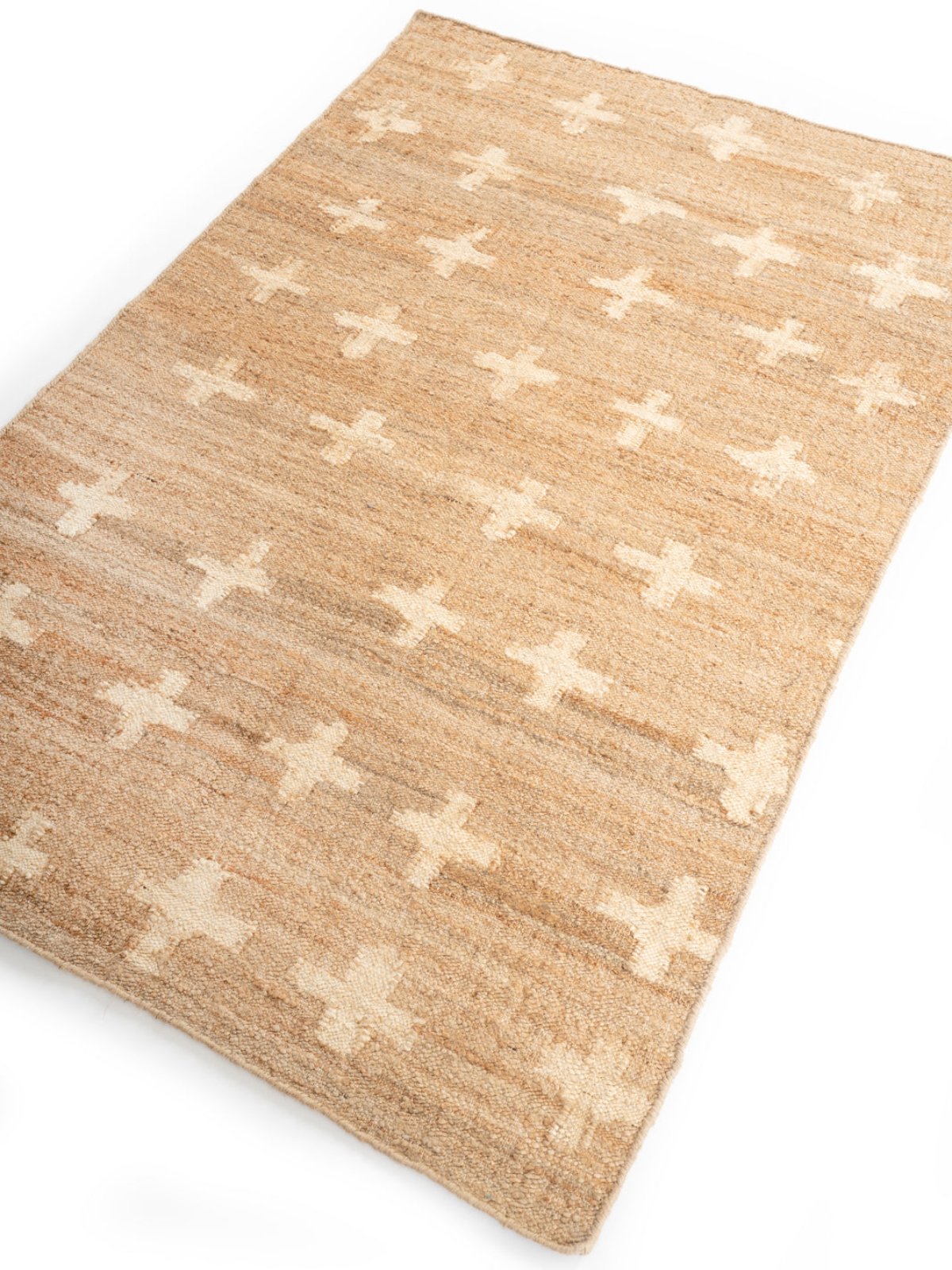 White Cross Jute Rug jute rug styled in a living room interior