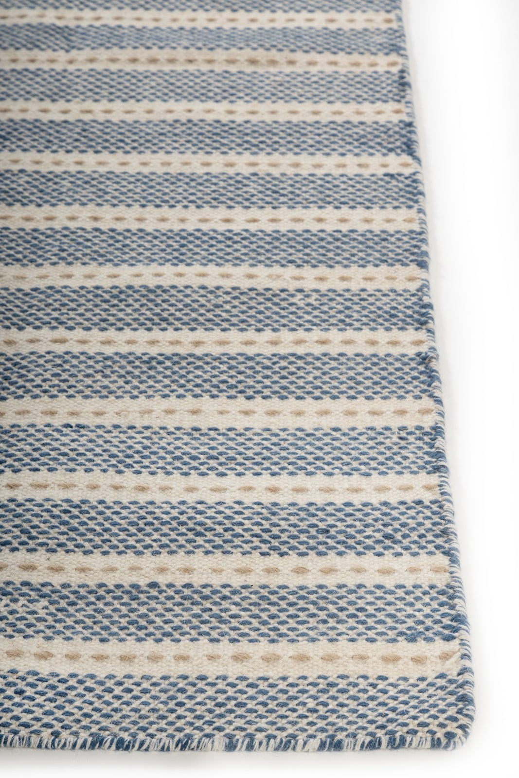 Winthorpe Wool Flatweave wool rug styled in a living room interior