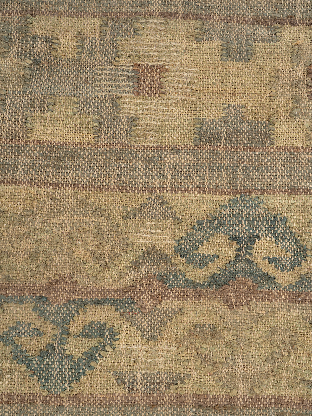 Woven Earth Chevron Jute Rug jute rug styled in a living room interior